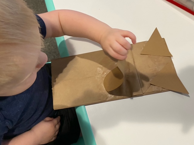 Making a paper bag craft animal at the table