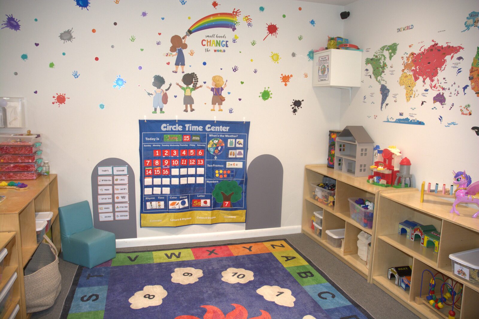 Circle time center with alphabet rug and world map wall